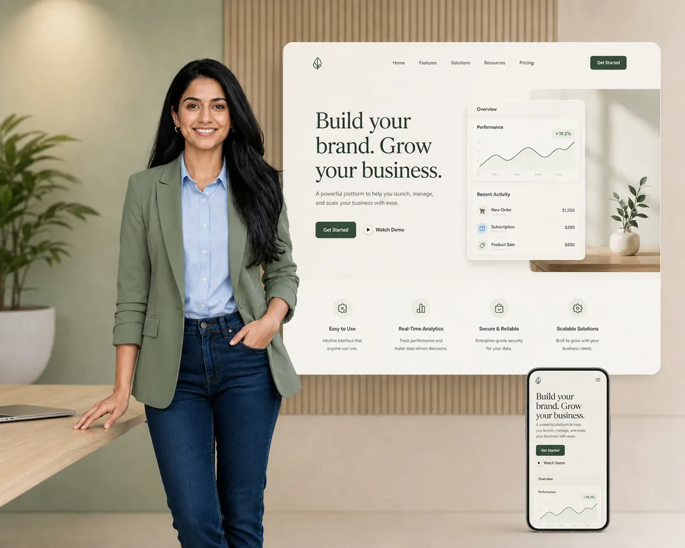Website designer presenting a responsive product-company website across desktop and mobile screens